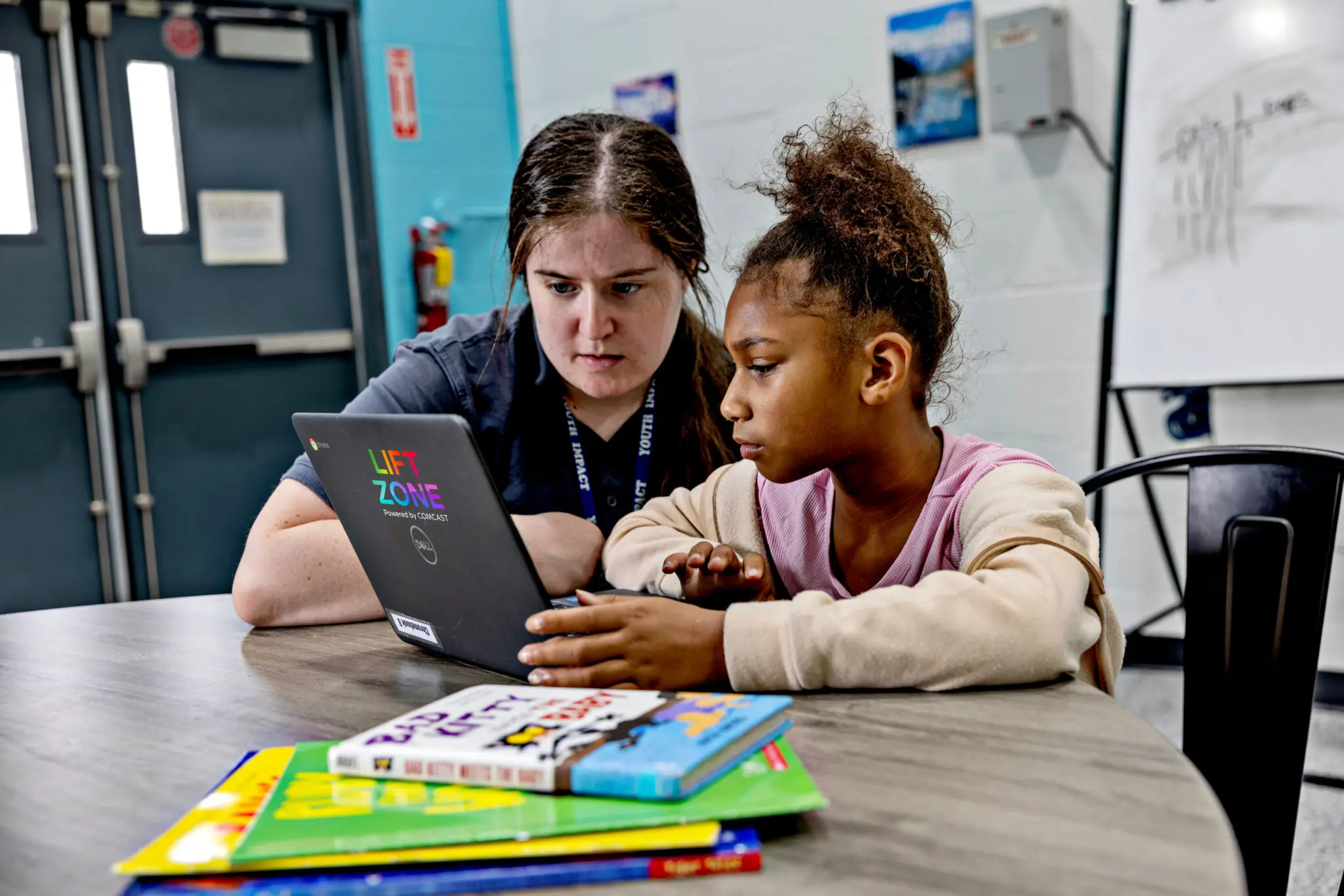 Student learning digital skills on a laptop.